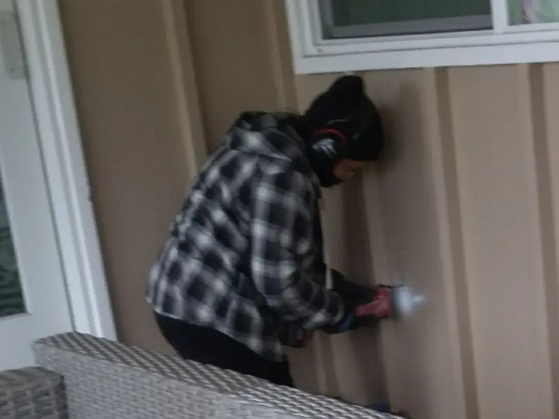 Professional electrician installing an exterior outlet in Straban
